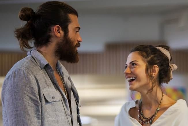 Romantic scene from Early Bird Turkish drama showing Sanem and Can sharing an emotional moment